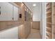 Custom walk-in closet with wood drawers, shelving, and hanging storage for organized elegance at 8130 Cassian Ct, Las Vegas, NV 89129