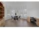 Bright dining area featuring a curved wall of windows and built-in storage at 8130 Cassian Ct, Las Vegas, NV 89129