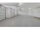Spacious garage with epoxy flooring and multiple garage doors at 8130 Cassian Ct, Las Vegas, NV 89129
