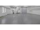 Spacious garage featuring epoxy flooring and lots of storage at 8130 Cassian Ct, Las Vegas, NV 89129