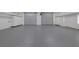 Spacious garage featuring epoxy flooring and lots of storage at 8130 Cassian Ct, Las Vegas, NV 89129