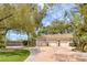Spacious three-car garage with a circular driveway, mature landscaping, and a well-manicured lawn enhances the property's appeal at 8130 Cassian Ct, Las Vegas, NV 89129