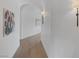 Hallway with wooden floors and art, adding elegance to the neutral color palette at 8130 Cassian Ct, Las Vegas, NV 89129