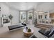 Bright and airy living room with a fireplace, comfortable seating, and large windows at 8130 Cassian Ct, Las Vegas, NV 89129