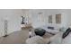 Spacious living room with modern fireplace, large sectional sofa, and open access to other areas of the house at 8130 Cassian Ct, Las Vegas, NV 89129