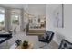 Open-concept living room and dining area with modern furnishings and stylish decor at 8130 Cassian Ct, Las Vegas, NV 89129