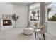 Cozy sitting area with natural light, featuring comfortable chairs and elegant decor at 8130 Cassian Ct, Las Vegas, NV 89129