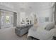 Bright main bedroom with a seating area, fireplace, and access to an outdoor space at 8130 Cassian Ct, Las Vegas, NV 89129