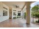 Covered patio featuring elegant columns, stamped concrete, and views of the backyard at 8130 Cassian Ct, Las Vegas, NV 89129