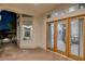 Elegant outdoor patio with seamless indoor-outdoor flow, showcasing neutral tones, refined design, and a glimpse of the pool at 8130 Cassian Ct, Las Vegas, NV 89129