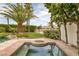 Relaxing spa with custom rockwork and landscaping, perfect for enjoying the outdoors at 8130 Cassian Ct, Las Vegas, NV 89129