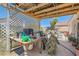 Covered back patio, ideal for outdoor entertaining and grilling with lattice privacy wall feature at 821 Tollbrook Way, Henderson, NV 89011