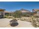 Backyard, including desert landscaping, block wall and view of the back of the house at 821 Tollbrook Way, Henderson, NV 89011