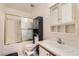 Standard bathroom featuring a shower-tub combination, vanity, and medicine cabinet at 821 Tollbrook Way, Henderson, NV 89011
