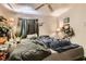Bedroom with a double bed, a desk, curtains, and a ceiling fan at 821 Tollbrook Way, Henderson, NV 89011