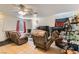 Comfortable living room featuring recliner seating and tile flooring throughout at 821 Tollbrook Way, Henderson, NV 89011