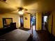 Bedroom with a ceiling fan, furniture, and doorways leading to the other rooms at 8237 Cline Mountain St, Las Vegas, NV 89131