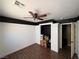 Well-lit bedroom boasts laminate flooring, a ceiling fan, and ample closet space at 8237 Cline Mountain St, Las Vegas, NV 89131