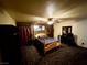 Spacious bedroom with a ceiling fan, furniture, and a patterned carpet at 8237 Cline Mountain St, Las Vegas, NV 89131