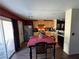 Eat-in kitchen features wood cabinetry, stainless-steel appliances, and a sliding glass door to the backyard at 8237 Cline Mountain St, Las Vegas, NV 89131