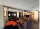 Spacious living area features comfortable seating, a ceiling fan, and built-in entertainment center at 8237 Cline Mountain St, Las Vegas, NV 89131