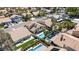 Aerial view highlighting a home with a private pool and landscaped backyard in a quiet neighborhood at 8714 Las Posas Ave, Las Vegas, NV 89147