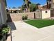 Well-maintained backyard featuring an outdoor storage shed, concrete patio, and artificial turf area at 8714 Las Posas Ave, Las Vegas, NV 89147
