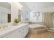 Large primary bathroom with soaking tub, shower and double sinks at 8714 Las Posas Ave, Las Vegas, NV 89147