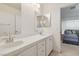 Bathroom with double sinks in the vanity open to the upstairs living room at 8714 Las Posas Ave, Las Vegas, NV 89147