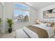 Bedroom with bench and large window, filled with natural light and privacy blinds at 8714 Las Posas Ave, Las Vegas, NV 89147