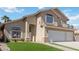 Home featuring a manicured lawn and walkway leading to the front door at 8714 Las Posas Ave, Las Vegas, NV 89147