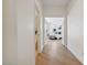 Hallway with wood floors that leads to a bedroom with natural light at 8714 Las Posas Ave, Las Vegas, NV 89147