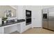 Kitchen boasts stainless appliances, modern cabinetry, and sleek countertops at 8714 Las Posas Ave, Las Vegas, NV 89147