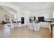Spacious kitchen features an island, stainless steel appliances, and bright white cabinets at 8714 Las Posas Ave, Las Vegas, NV 89147