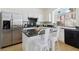 Kitchen features granite counters, a breakfast bar, and modern appliances at 8714 Las Posas Ave, Las Vegas, NV 89147