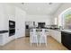 Bright kitchen with island, white cabinets, and stainless steel appliances at 8714 Las Posas Ave, Las Vegas, NV 89147