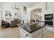Open concept living room boasts a fireplace, neutral tones and tile flooring at 8714 Las Posas Ave, Las Vegas, NV 89147
