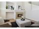 Bright living room features a cozy fireplace and high ceilings at 8714 Las Posas Ave, Las Vegas, NV 89147