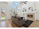 Spacious living room with a fireplace and a high ceiling with many windows at 8714 Las Posas Ave, Las Vegas, NV 89147