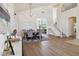 Bright living area with dining table and open access to the staircase and second story at 8714 Las Posas Ave, Las Vegas, NV 89147