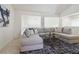 Living room with vaulted ceilings, large sectional, and decorative rug at 8714 Las Posas Ave, Las Vegas, NV 89147