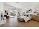 Large main bedroom with wood floors, fireplace, access to the backyard and great natural light at 8714 Las Posas Ave, Las Vegas, NV 89147
