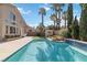 Refreshing pool with lush landscaping and a well-maintained patio, ideal for outdoor enjoyment at 8714 Las Posas Ave, Las Vegas, NV 89147