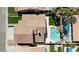 Aerial view of a backyard featuring a blue swimming pool, small grass yard at 8714 Las Posas Ave, Las Vegas, NV 89147