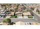 Street view of well-maintained houses with desert landscaping, tile roofs, and solar panels in a suburban neighborhood at 8714 Las Posas Ave, Las Vegas, NV 89147