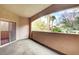 A neutral toned balcony offers outdoor living with a view of lush trees and vegetation at 8725 Red Rio Dr # 203, Las Vegas, NV 89128