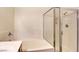 A shower with a glass door and a tiled shower-tub combination at 8725 Red Rio Dr # 203, Las Vegas, NV 89128