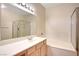 Bathroom with vanity, mirror, shower over tub with glass door at 8725 Red Rio Dr # 203, Las Vegas, NV 89128