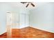 Large bedroom featuring hardwood floors, closet, and access to connecting room at 8725 Red Rio Dr # 203, Las Vegas, NV 89128