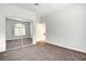 A carpeted bedroom with a large mirrored closet and a window at 8725 Red Rio Dr # 203, Las Vegas, NV 89128